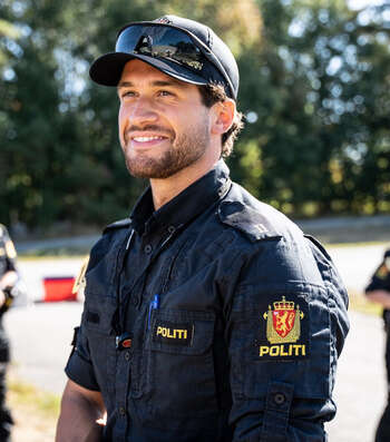 Male police student smiling 