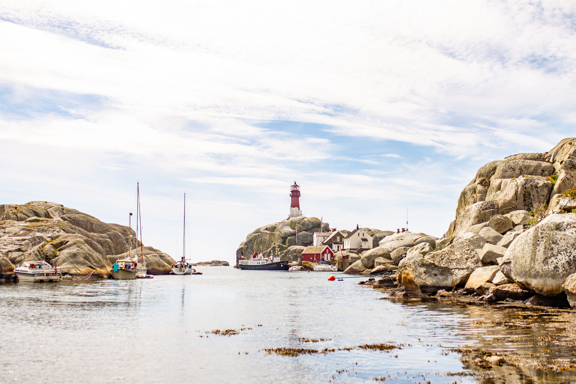 Image may contain: cloud, lighthouse, water, sky. 