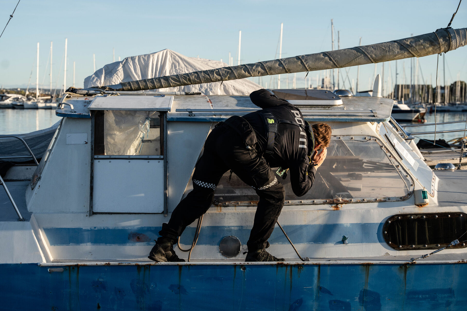  Police officer Edmund investigates an abandoned boat